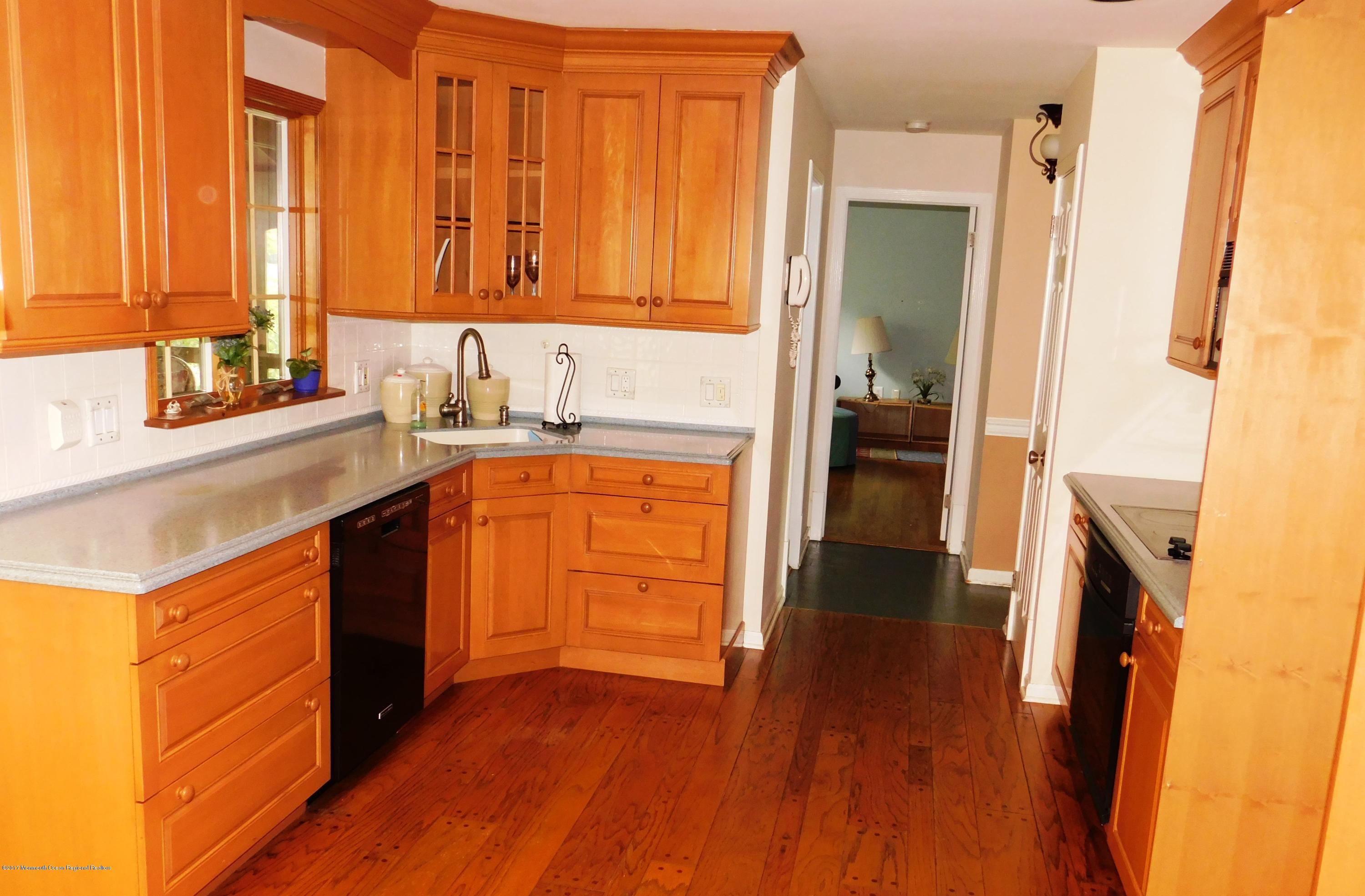 68 Stavola Road Middletown, NJ 07748 - Photo 13 of 49 a kitchen with a sink a refrigerator and a stove