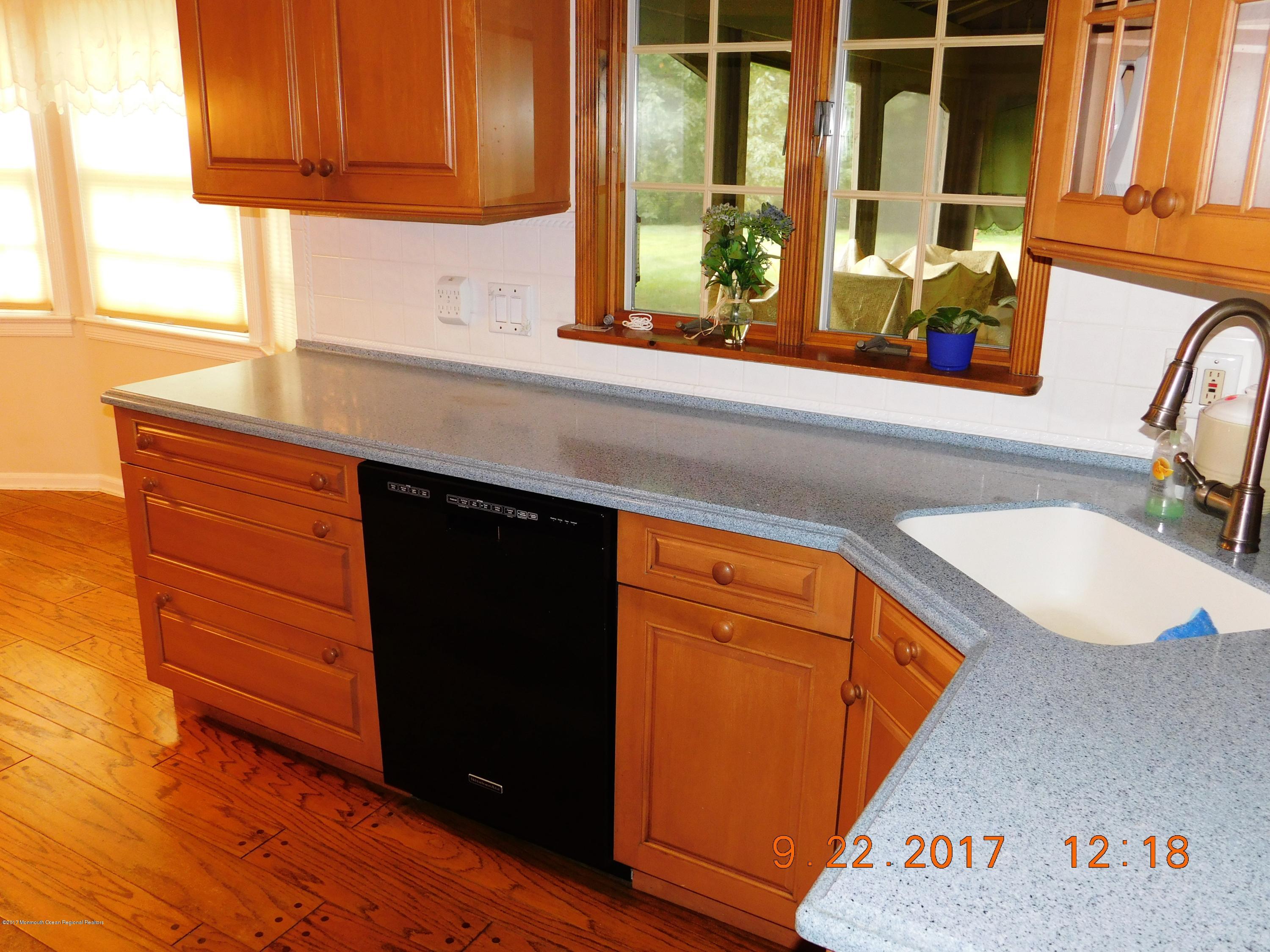 68 Stavola Road Middletown, NJ 07748 - Photo 15 of 49 a kitchen with a sink and a window