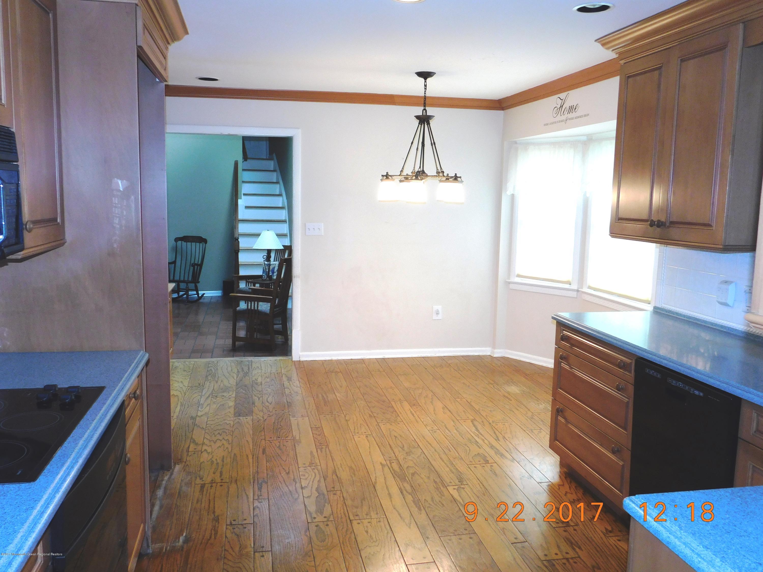 68 Stavola Road Middletown, NJ 07748 - Photo 16 of 49 a view of kitchen with granite countertop cabinets and wooden floor