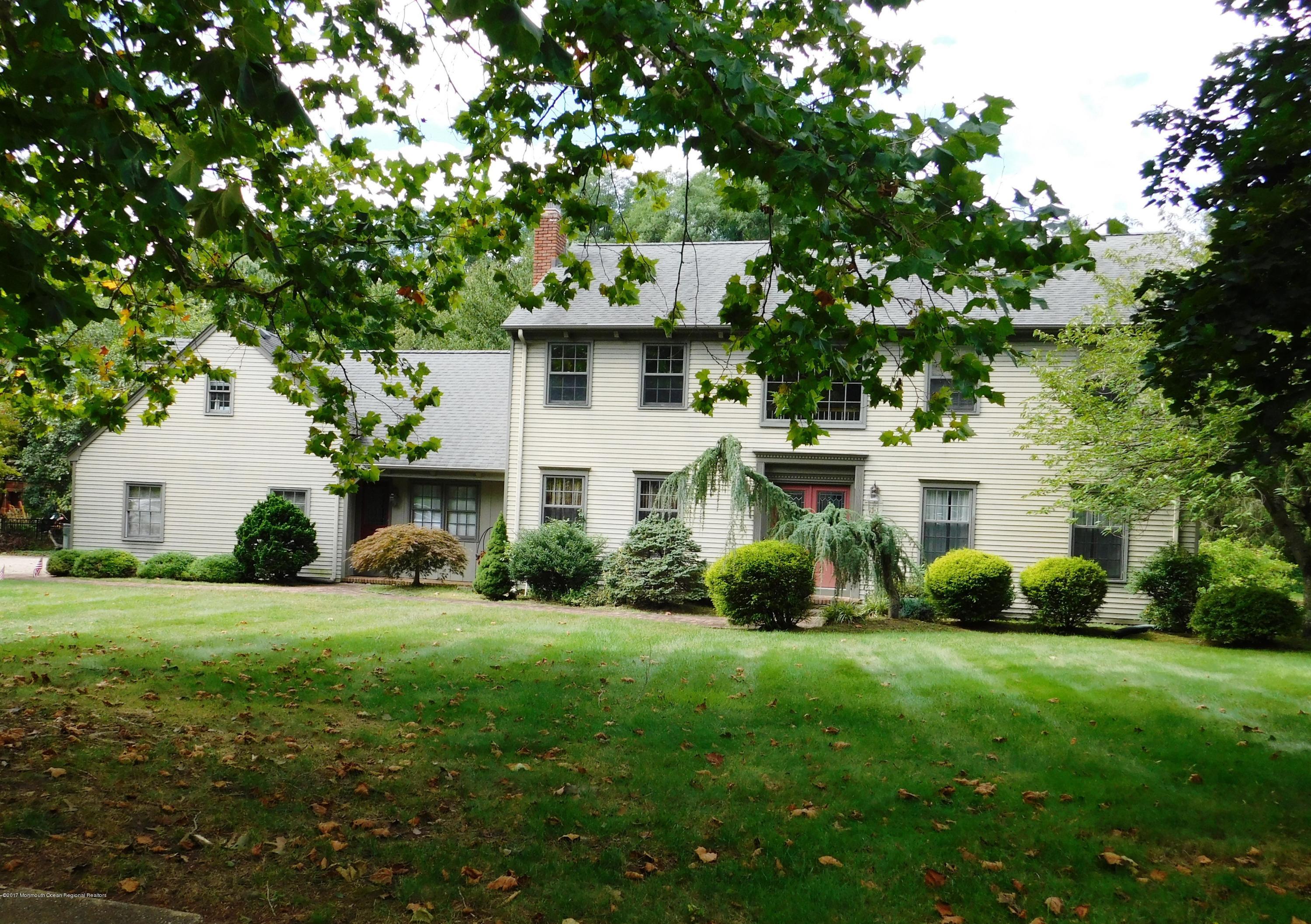 68 Stavola Road Middletown, NJ 07748 - Photo 2 of 49 a front view of a house with a garden