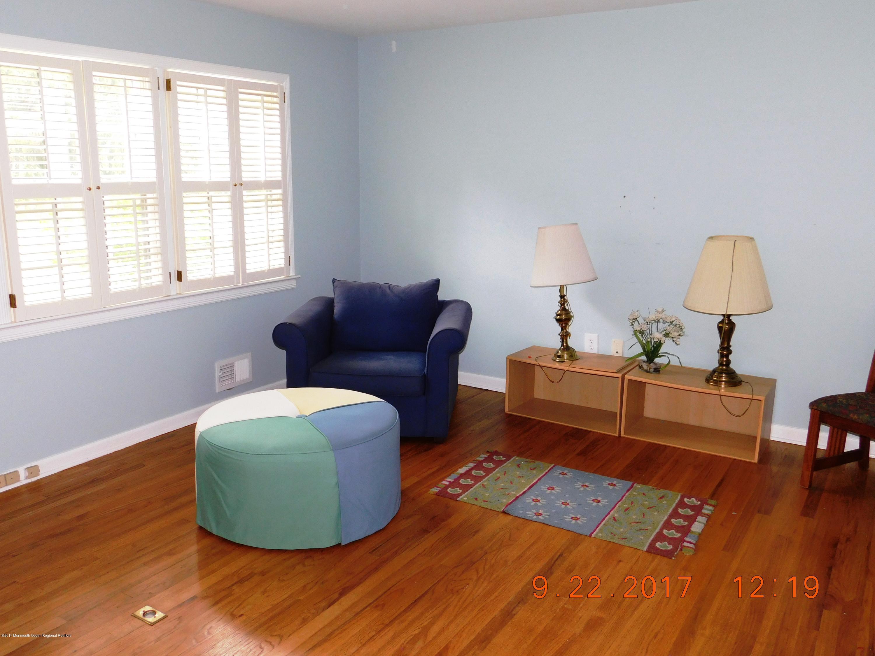 68 Stavola Road Middletown, NJ 07748 - Photo 21 of 49 a living room with furniture and a lamp
