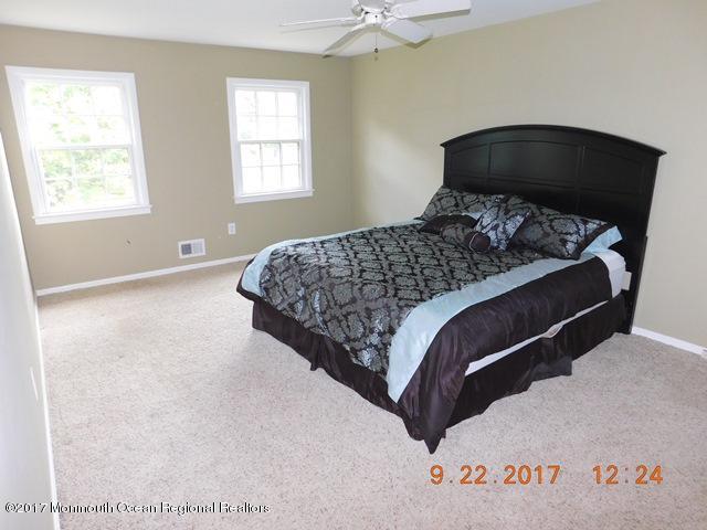 68 Stavola Road Middletown, NJ 07748 - Photo 23 of 49 a bedroom with a bed and window