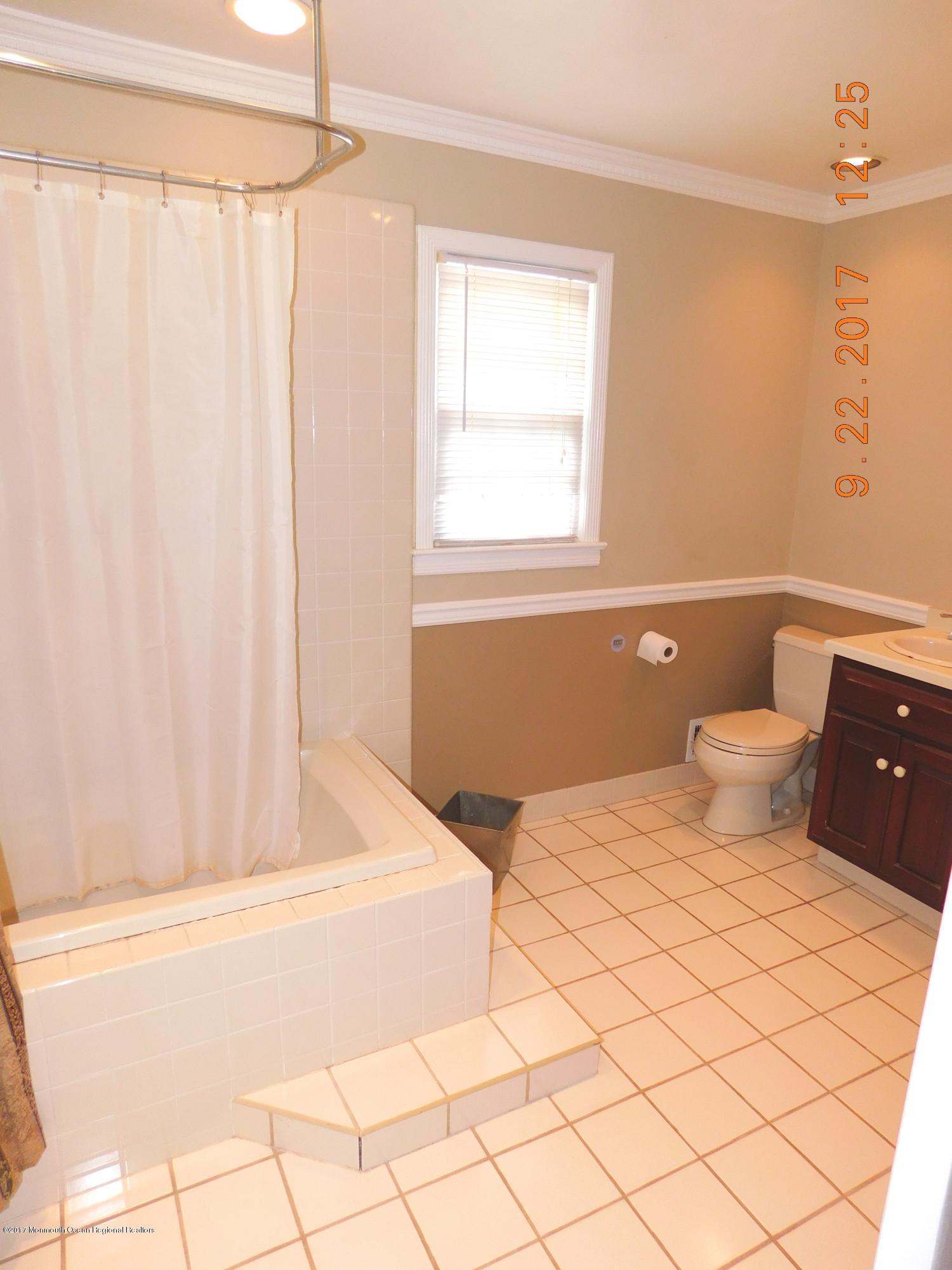 68 Stavola Road Middletown, NJ 07748 - Photo 25 of 49 a bedroom with a bed and a window