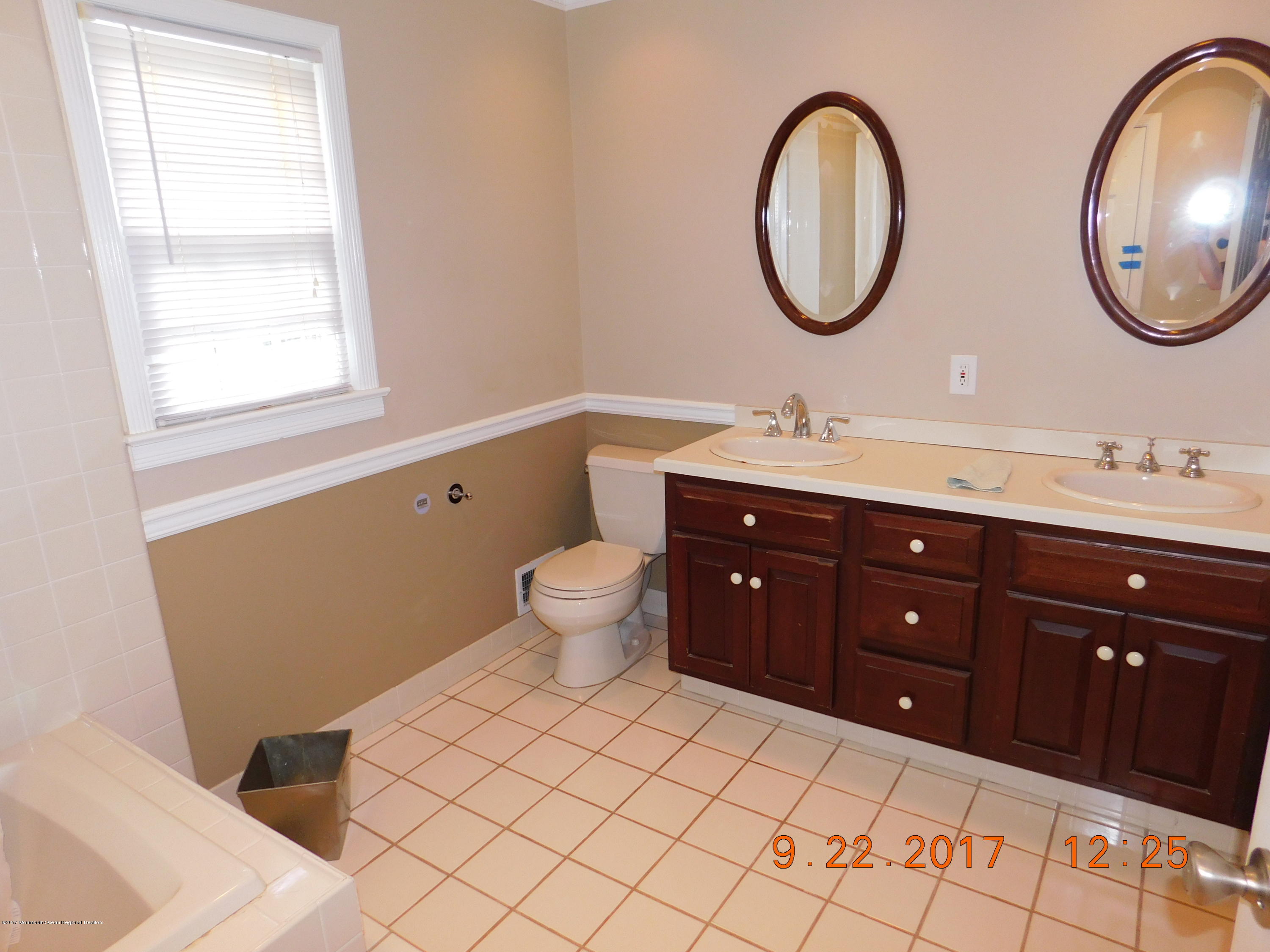 68 Stavola Road Middletown, NJ 07748 - Photo 26 of 49 a bathroom with a toilet sink and mirror