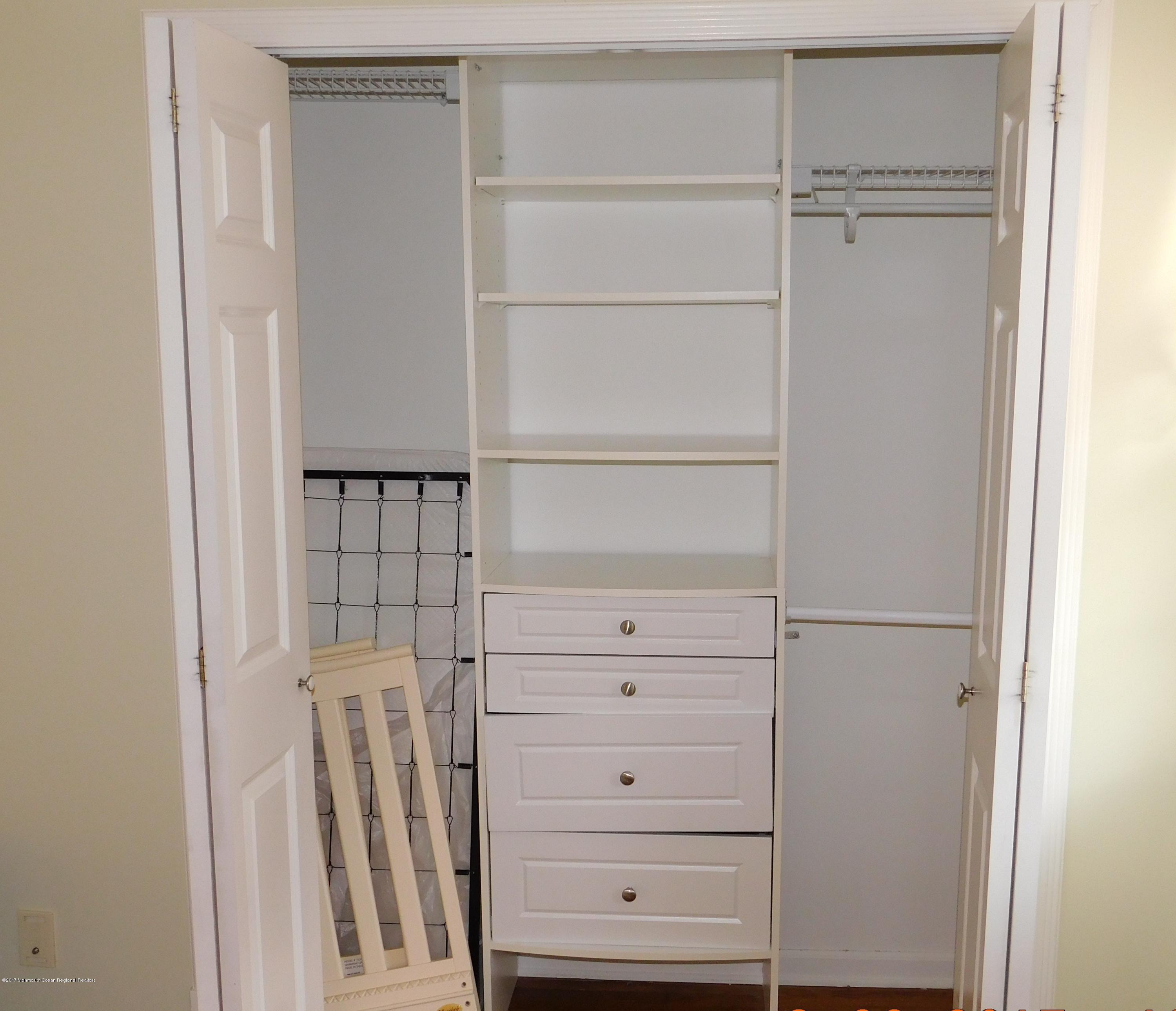 68 Stavola Road Middletown, NJ 07748 - Photo 31 of 49 a view of walk in closet with empty racks