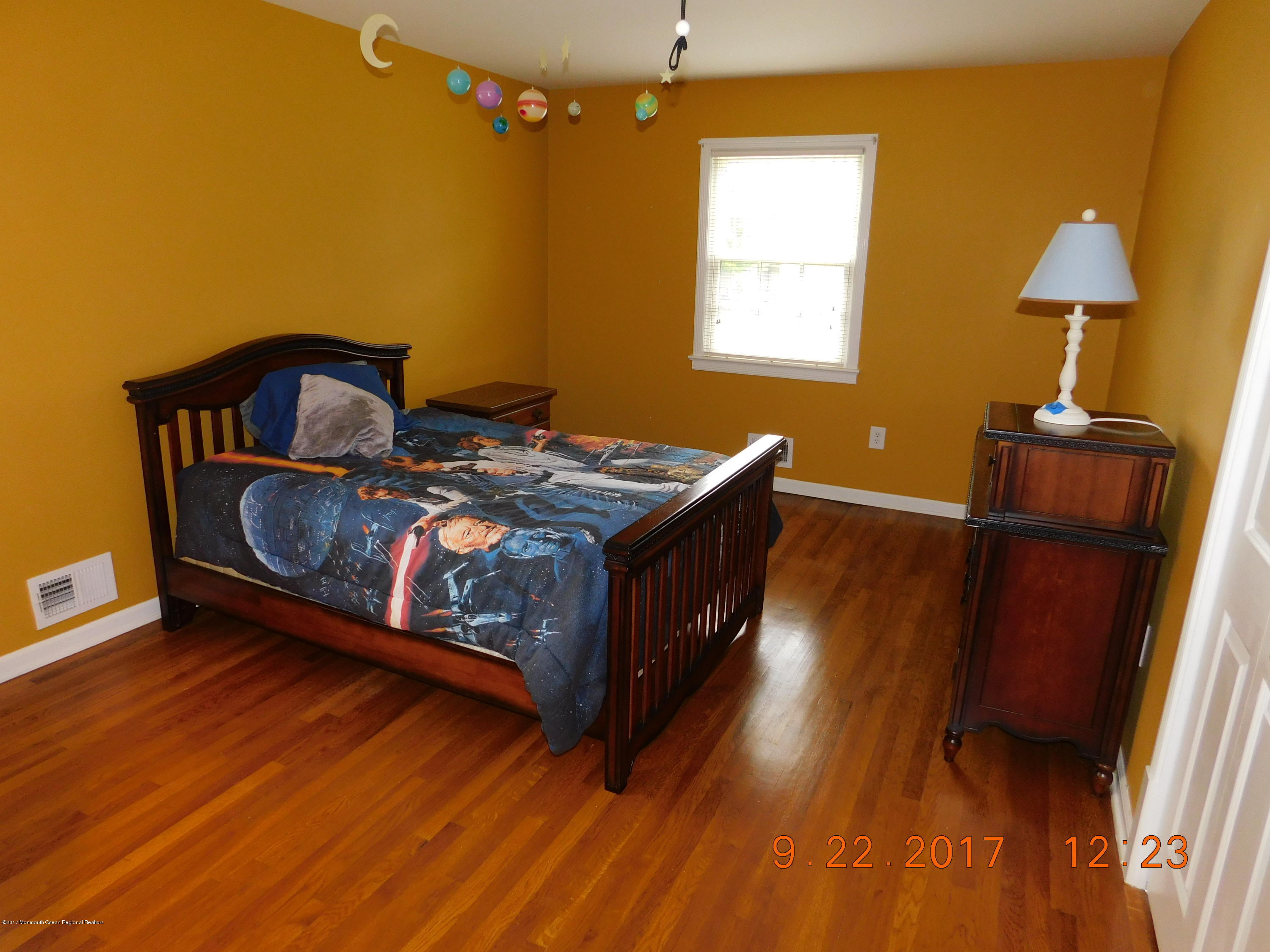 68 Stavola Road Middletown, NJ 07748 - Photo 32 of 49 a bed sitting in a bedroom next to a window