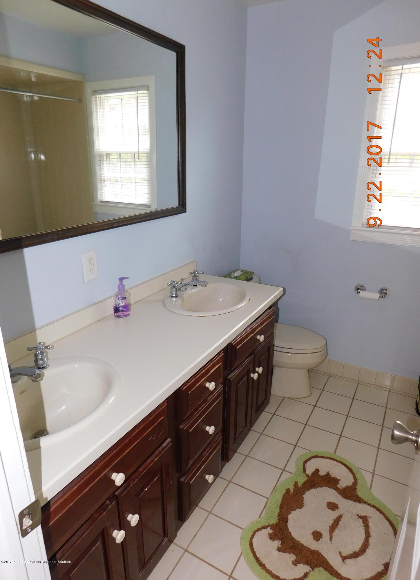 68 Stavola Road Middletown, NJ 07748 - Photo 34 of 49 a bathroom with a sink vanity and a toilet