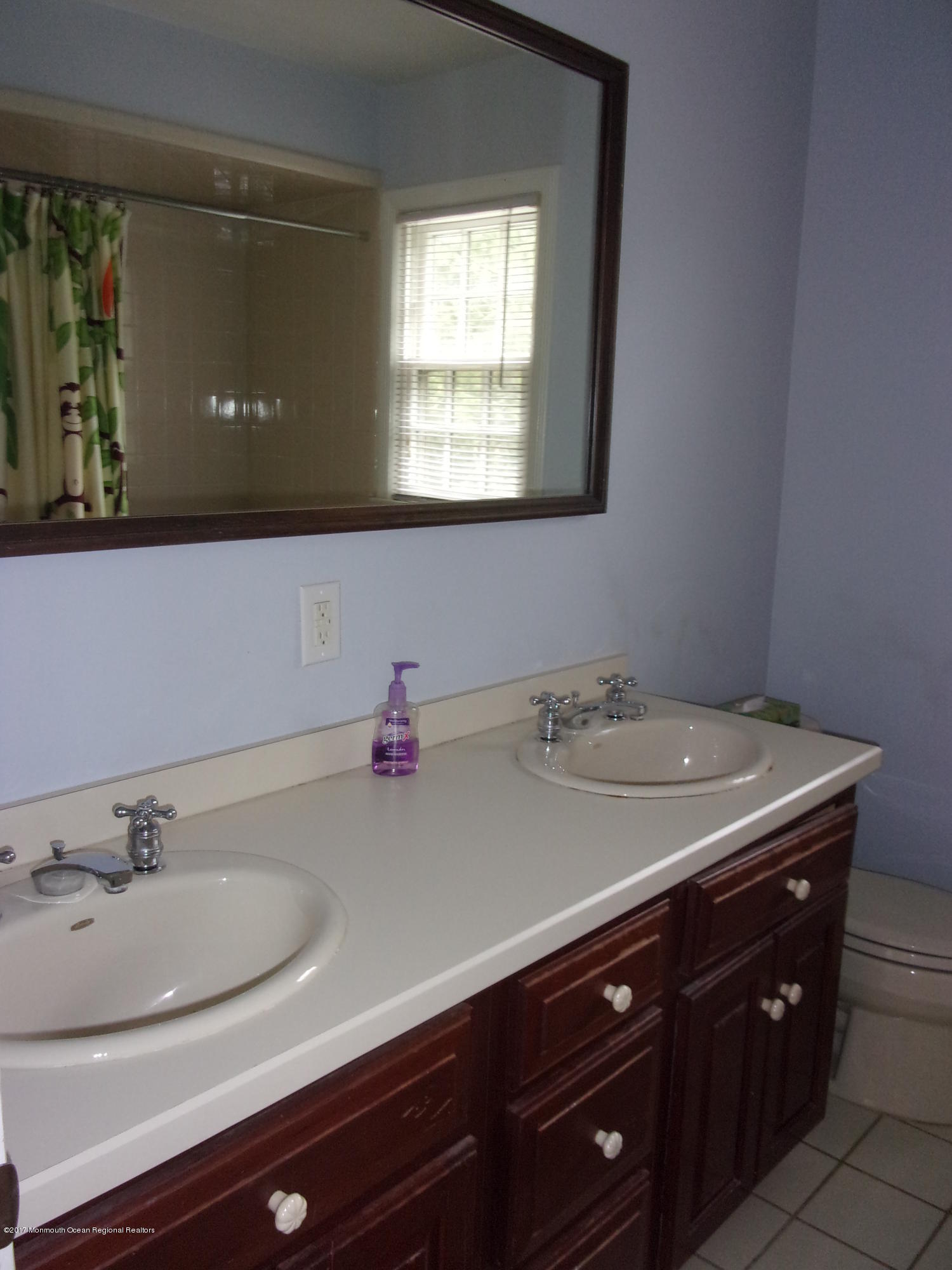 68 Stavola Road Middletown, NJ 07748 - Photo 35 of 49 a bathroom with a sink and a mirror