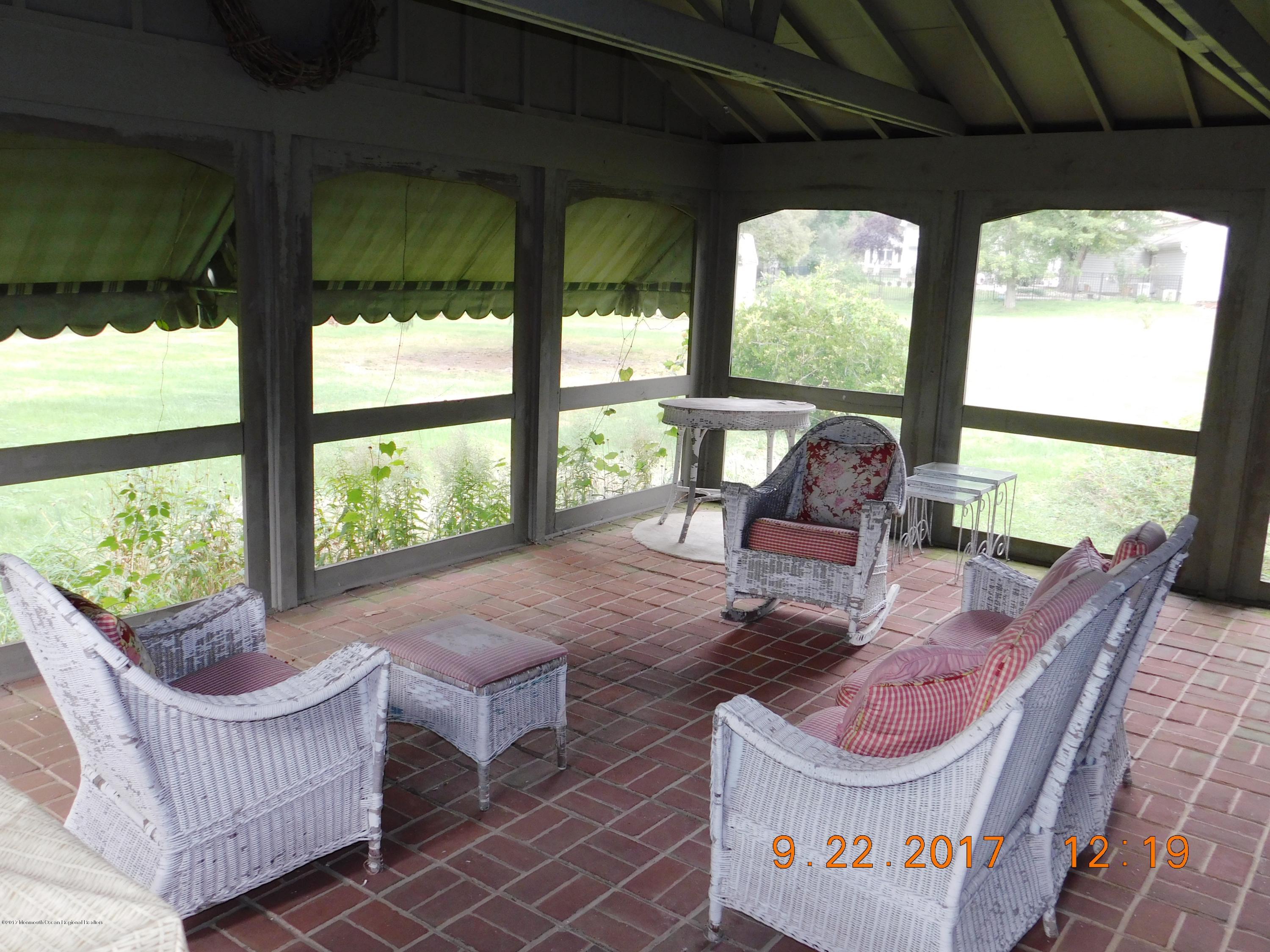 68 Stavola Road Middletown, NJ 07748 - Photo 37 of 49 a living room with furniture and a large window