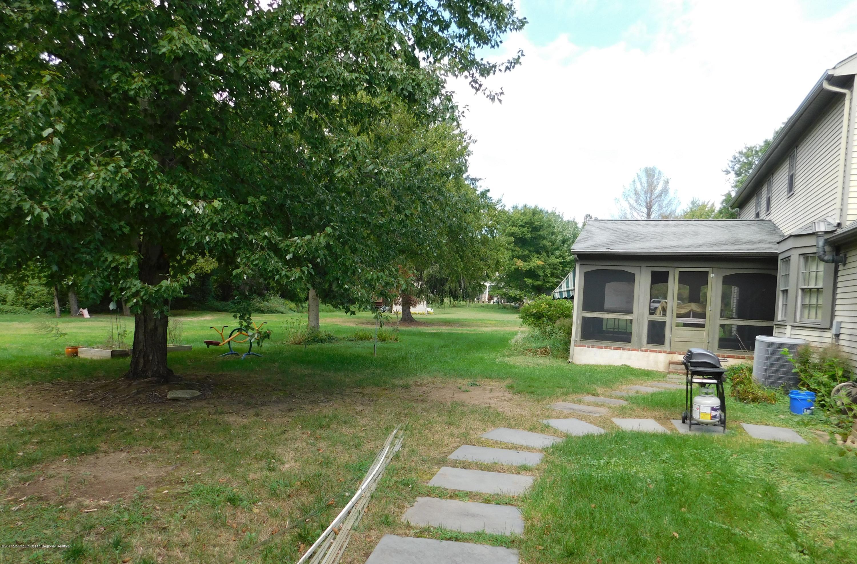 68 Stavola Road Middletown, NJ 07748 - Photo 44 of 49 a front view of a house with garden