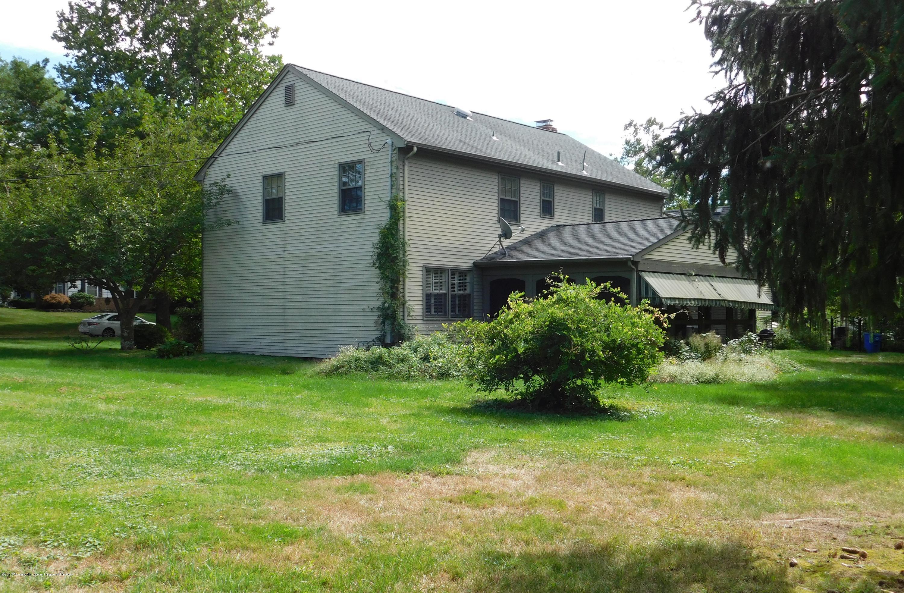 68 Stavola Road Middletown, NJ 07748 - Photo 49 of 49 a front view of house with a garden