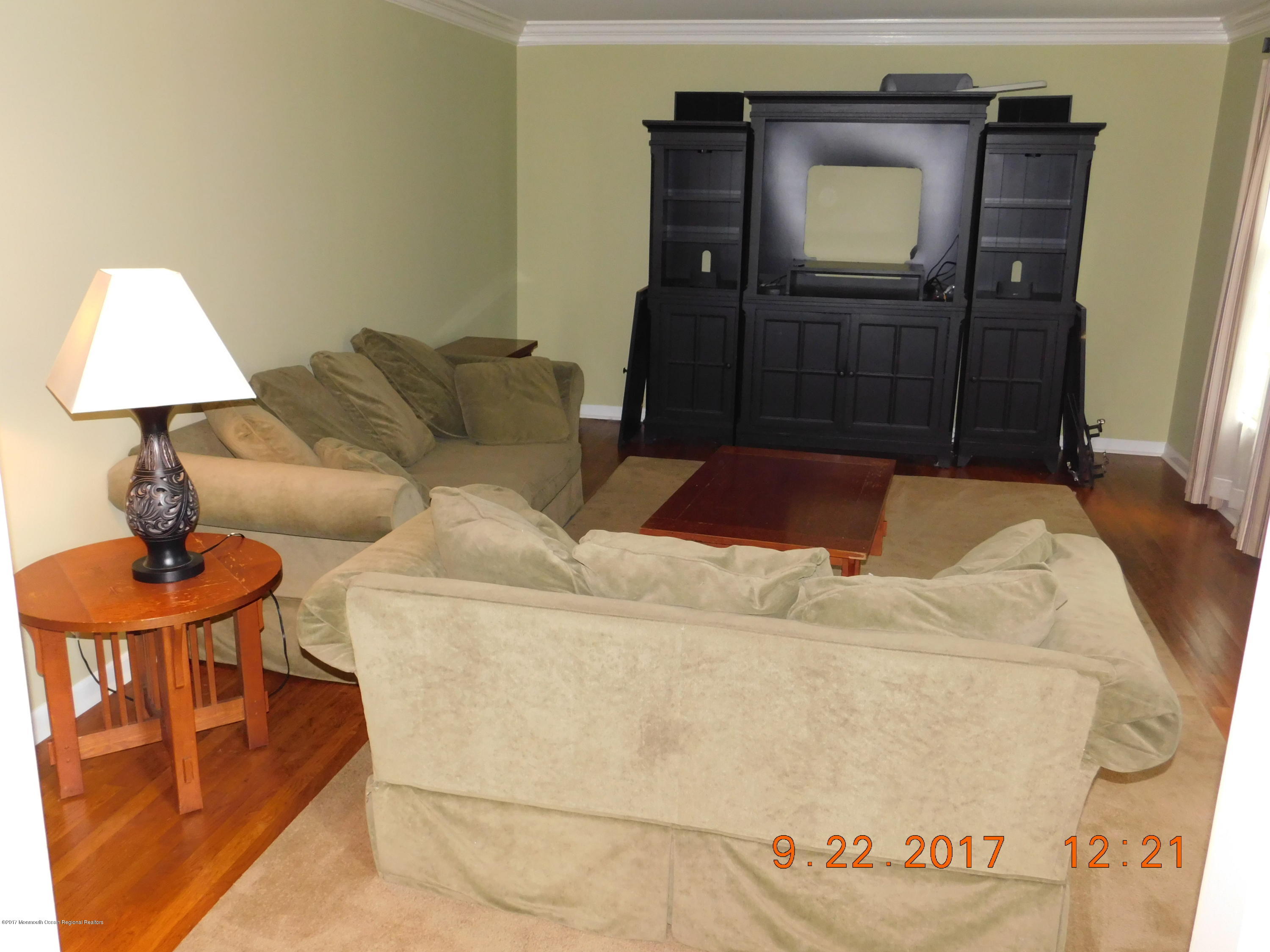 68 Stavola Road Middletown, NJ 07748 - Photo 9 of 49 a living room with a couch and a table