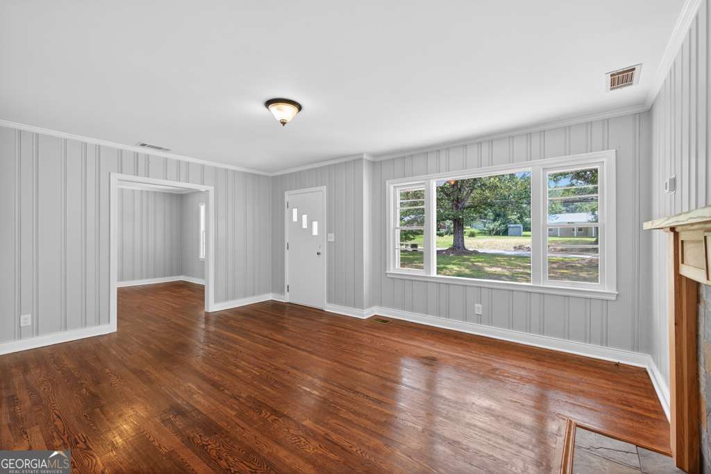 150 Jefferson River Road Athens, GA 30607 - Photo 12 of 76 a view of an empty room with wooden floor and a window
