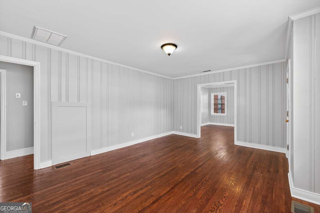 150 Jefferson River Road Athens, GA 30607 - Photo 13 of 76 a view of an empty room with wooden floor and a window