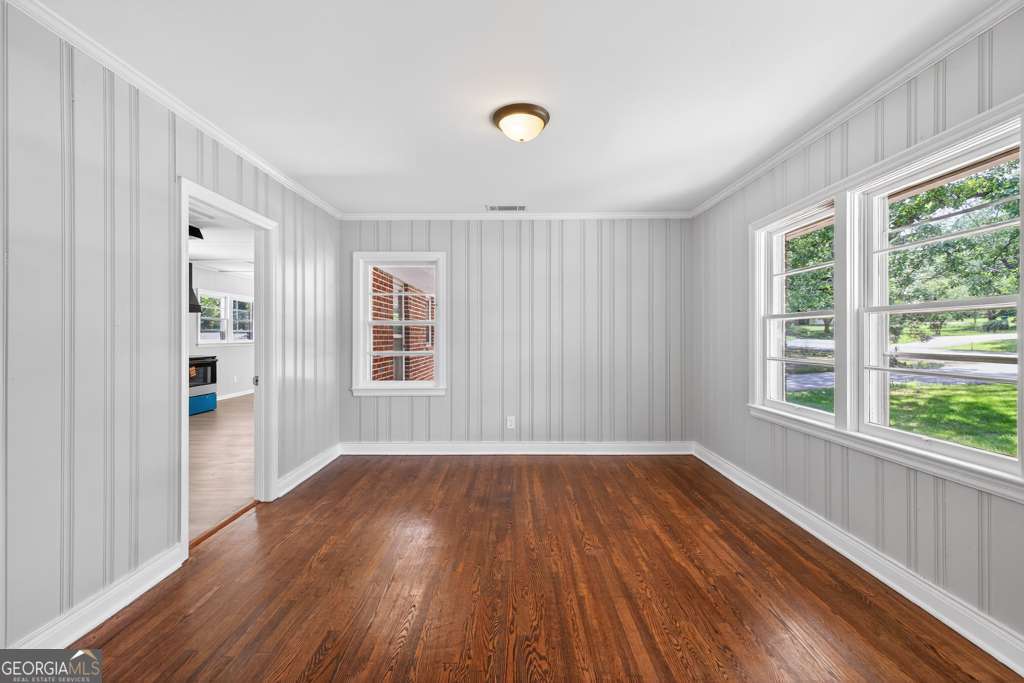 150 Jefferson River Road Athens, GA 30607 - Photo 14 of 76 a view of an empty room with wooden floor and a window