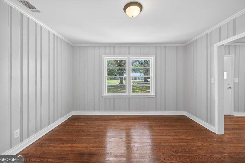 150 Jefferson River Road Athens, GA 30607 - Photo 15 of 76 an empty room with wooden floor and windows