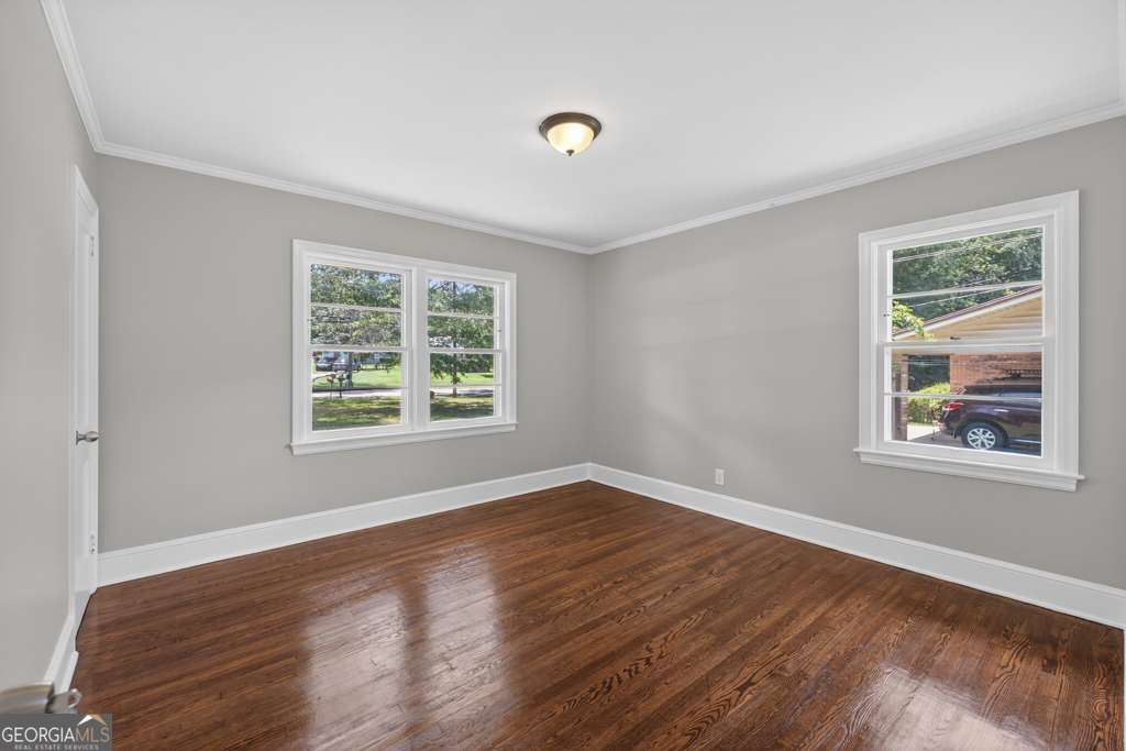 150 Jefferson River Road Athens, GA 30607 - Photo 18 of 76 a view of an empty room with wooden floor and a window