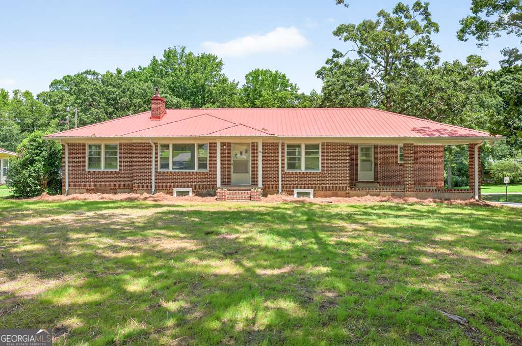 150 Jefferson River Road Athens, GA 30607 - Photo 2 of 76 a front view of a house with a garden