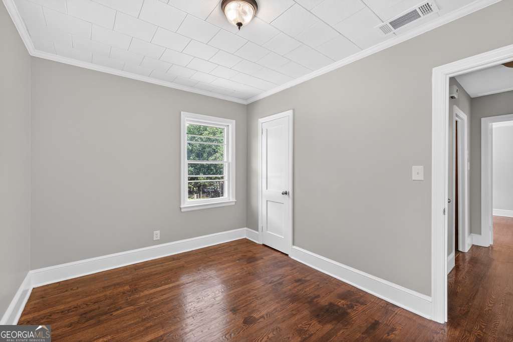 150 Jefferson River Road Athens, GA 30607 - Photo 22 of 76 an empty room with wooden floor and windows