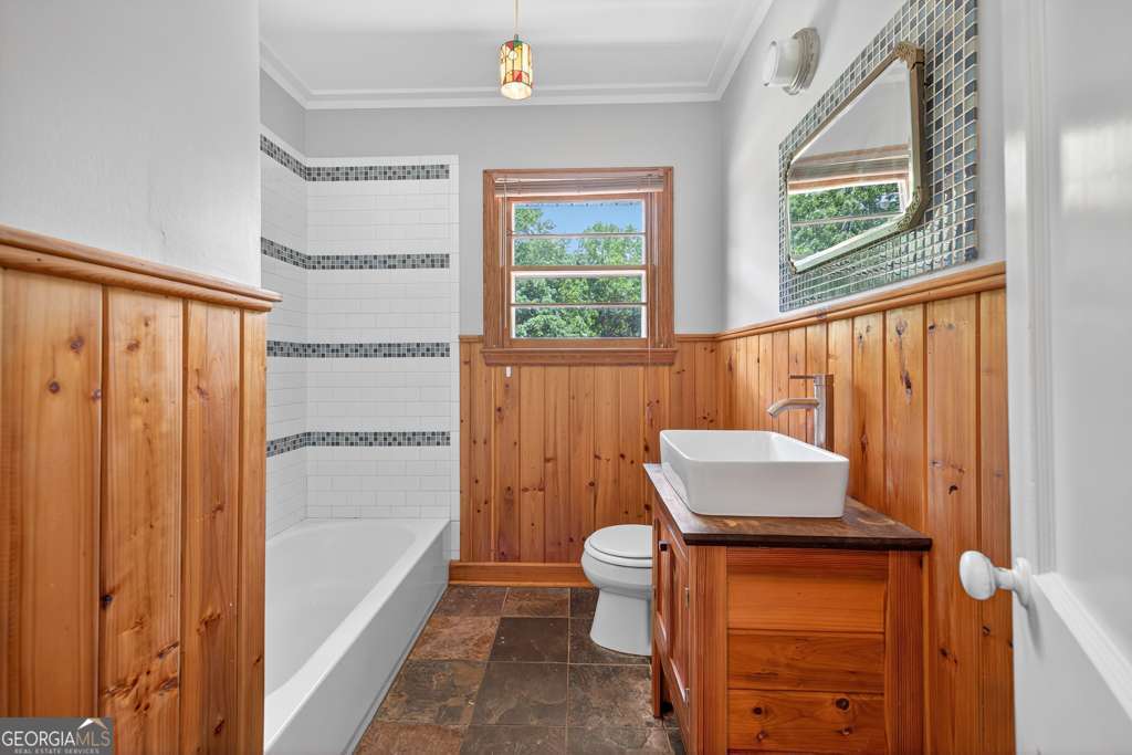 150 Jefferson River Road Athens, GA 30607 - Photo 24 of 76 a bathroom with a toilet a sink and a window