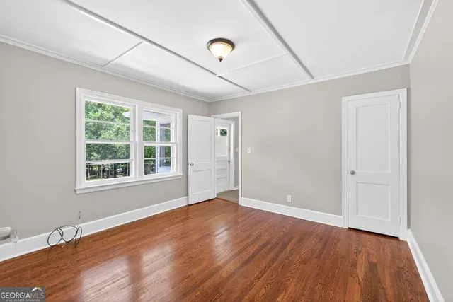 a kitchen with stainless steel appliances granite countertop a stove cabinets and wooden floor