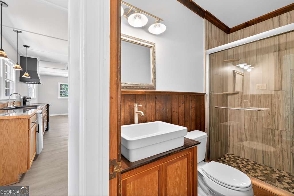 150 Jefferson River Road Athens, GA 30607 - Photo 28 of 76 a bathroom with a sink a toilet a mirror and shower