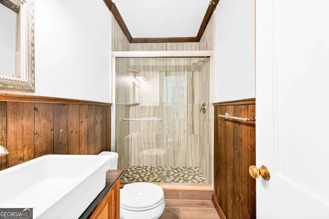 a large kitchen with stainless steel appliances kitchen island a large counter space a sink and a window