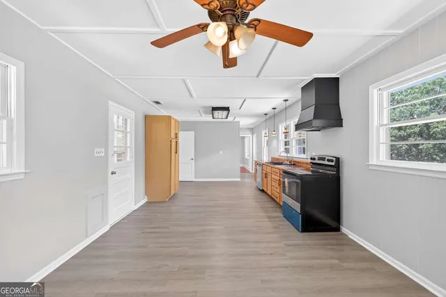 a view of room with wooden floor