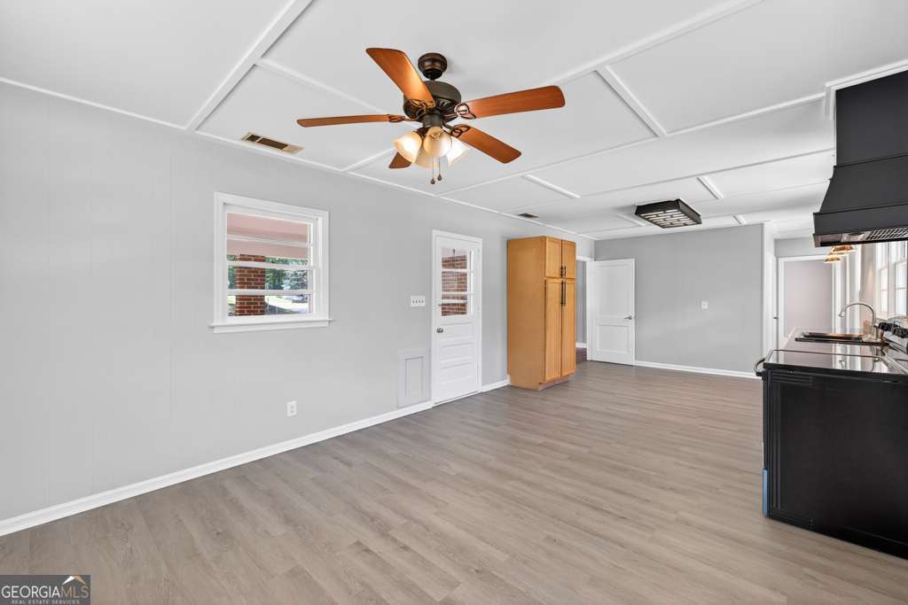 150 Jefferson River Road Athens, GA 30607 - Photo 37 of 76 a view of a livingroom with a ceiling fan wooden floor and a ceiling fan