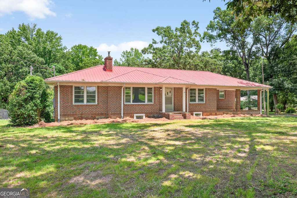 150 Jefferson River Road Athens, GA 30607 - Photo 4 of 76 a front view of a house with a garden
