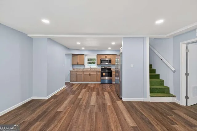a bathroom with a sink a mirror and a shower