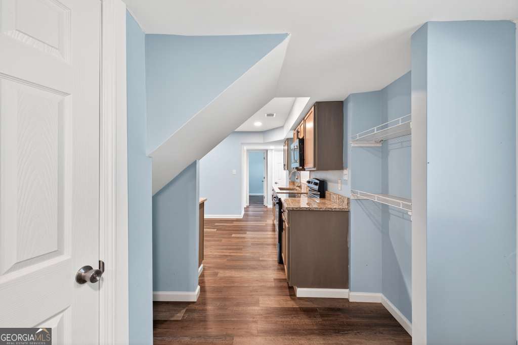 150 Jefferson River Road Athens, GA 30607 - Photo 45 of 76 a view of a kitchen and an empty room with wooden floor