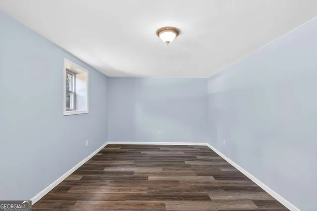 an aerial view of a house with swimming pool and garden