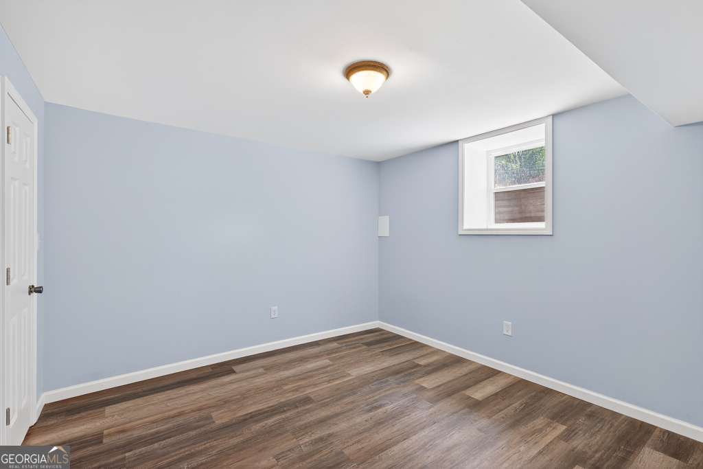 150 Jefferson River Road Athens, GA 30607 - Photo 49 of 76 a view of an empty room with wooden floor and a window