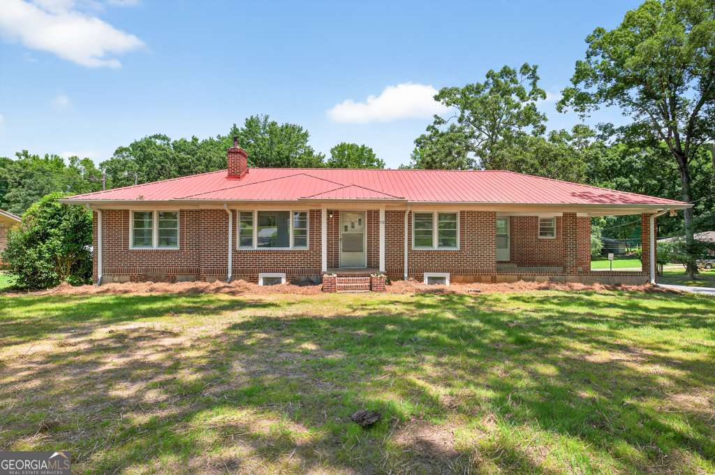 150 Jefferson River Road Athens, GA 30607 - Photo 5 of 76 a front view of a house with a garden
