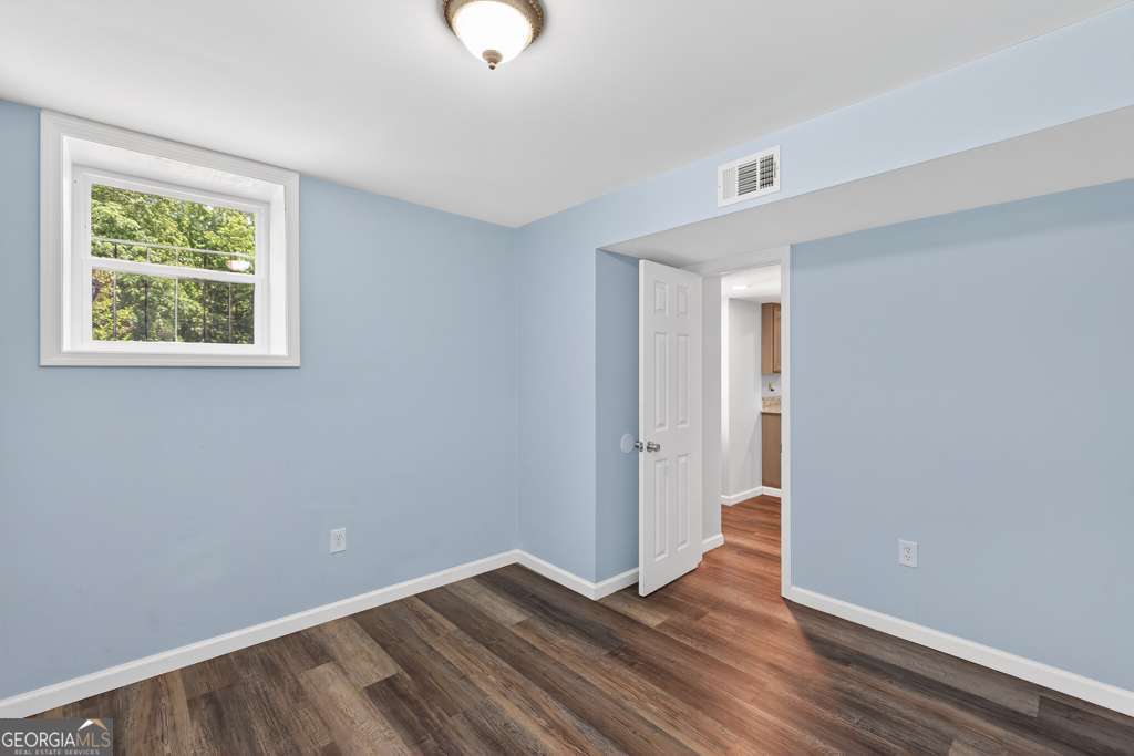 150 Jefferson River Road Athens, GA 30607 - Photo 52 of 76 a view of an empty room with wooden floor and a window