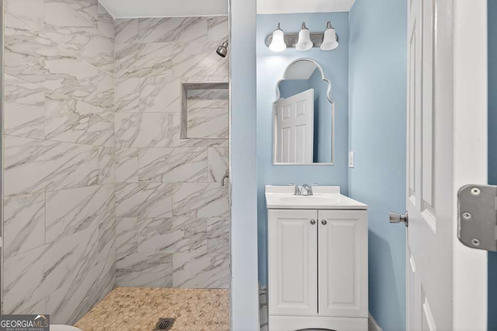 150 Jefferson River Road Athens, GA 30607 - Photo 53 of 76 a bathroom with a sink a mirror and a shower