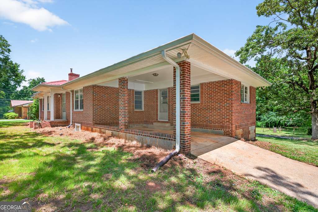 150 Jefferson River Road Athens, GA 30607 - Photo 7 of 76 a front view of a house with a yard and garage