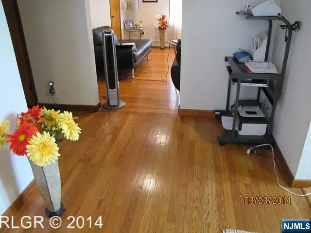 a view of a workspace with wooden floor