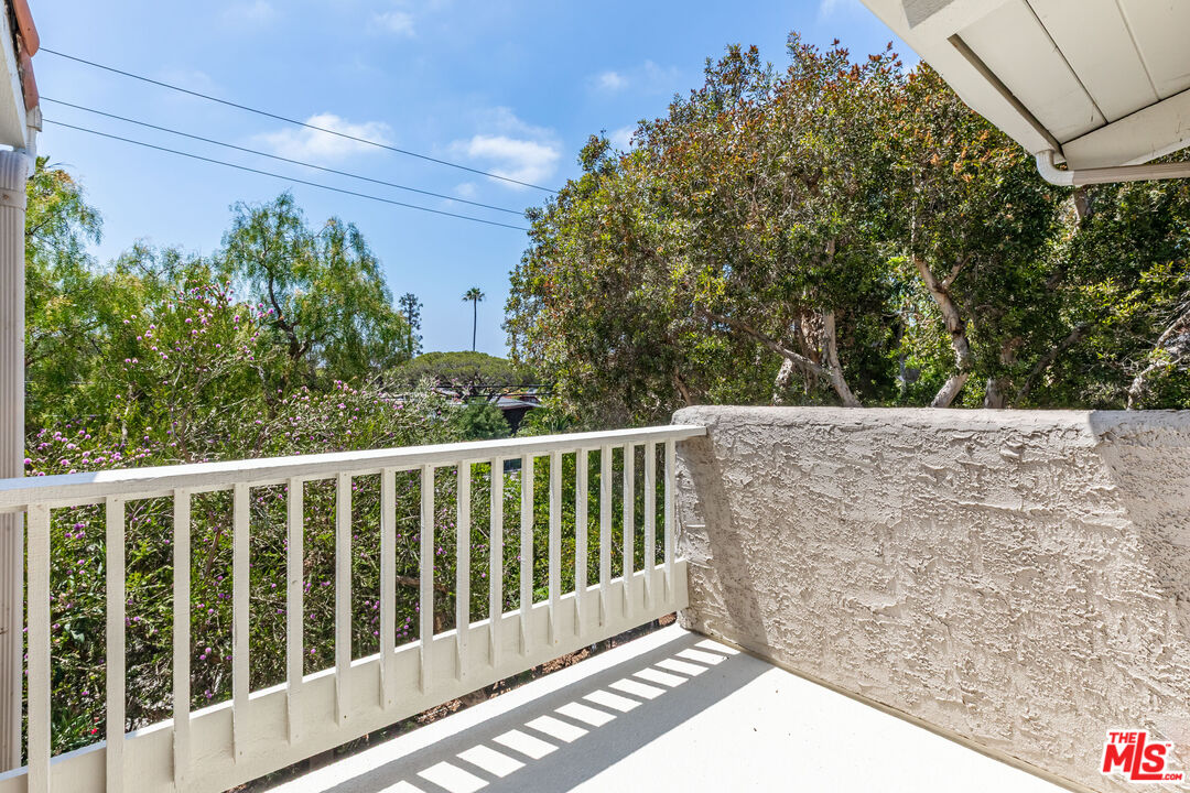 28368 Rey De Copas Lane Malibu, CA 90265 - Photo 20 of 31 a view of a balcony with wooden fence