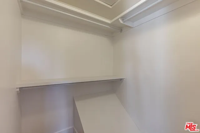 a view of an empty walk in closet
