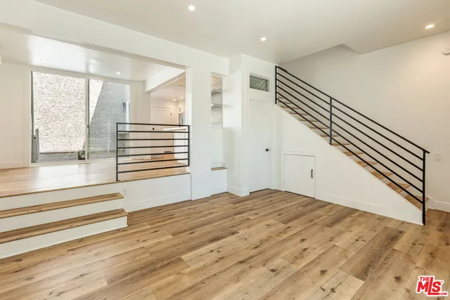 a view of room with window and hardwood floor
