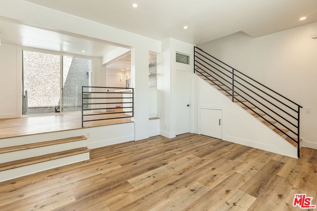 28368 Rey De Copas Lane Malibu, CA 90265 - Photo 4 of 31 a view of room with window and hardwood floor