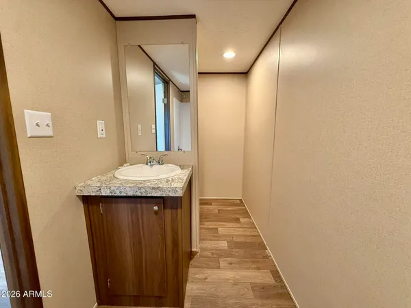 a bathroom with sink and mirror