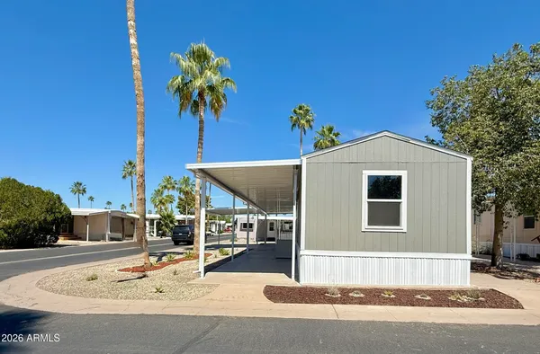 a house with palm tree in front of it