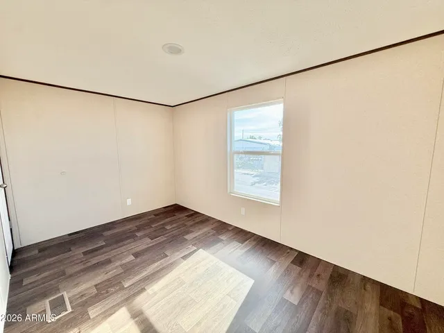 a view of storage and utility room with racks on the wall