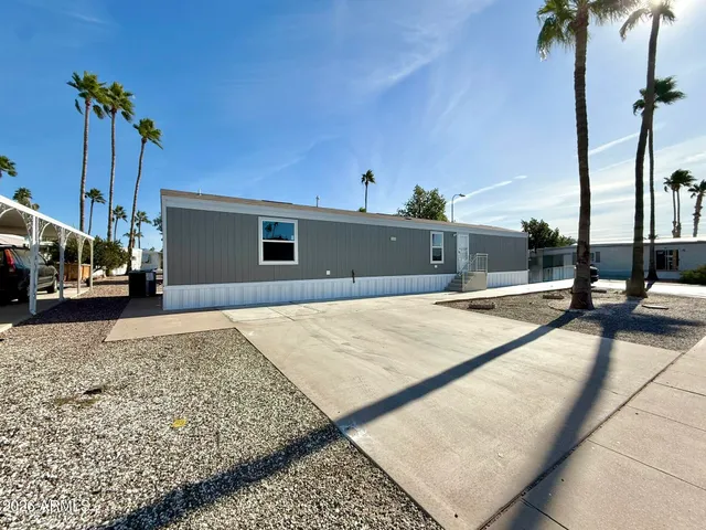 a living room with lots of furniture and a wooden floor