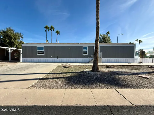 a living room with stainless steel appliances kitchen island granite countertop furniture and a kitchen view