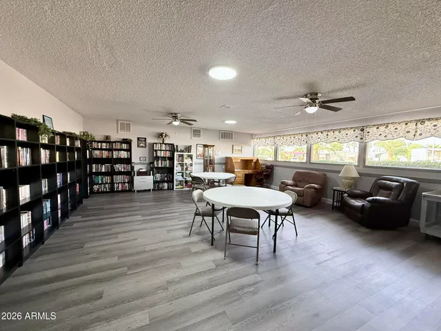 a view of a swimming pool with an outdoor seating