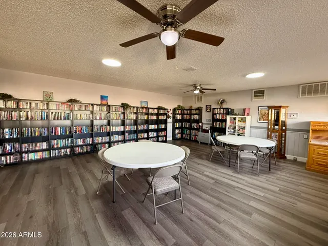 a view of a swimming pool with an outdoor seating